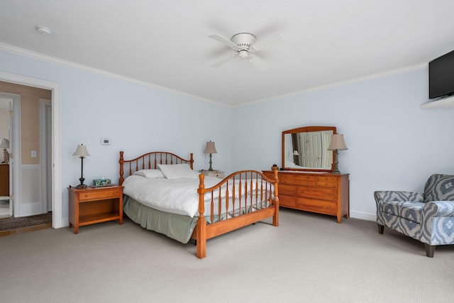 bedroom featuring ceiling fan, carpet, and ornamental molding