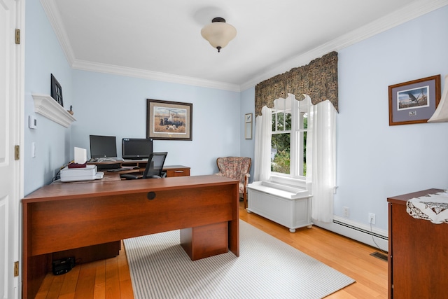 office area with crown molding and light hardwood / wood-style floors