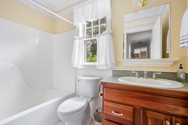 full bathroom featuring toilet, vanity, and  shower combination