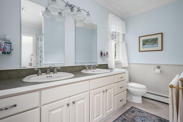 bathroom with toilet, a baseboard radiator, tile patterned floors, ornamental molding, and vanity