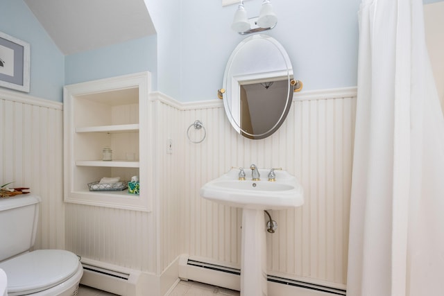 bathroom with a baseboard radiator, tile patterned floors, toilet, and lofted ceiling