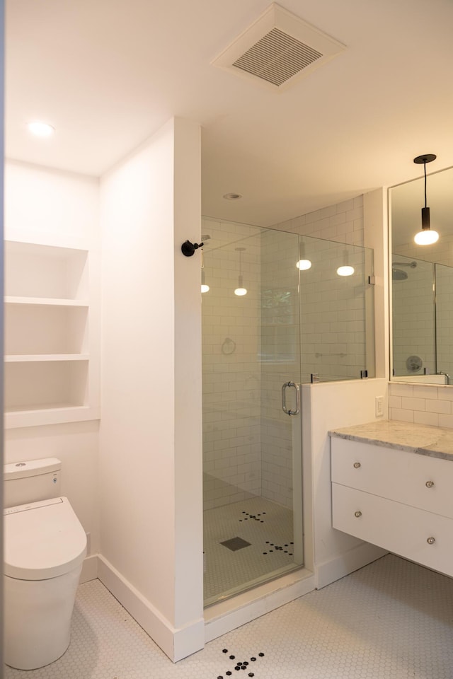 bathroom with vanity, toilet, an enclosed shower, and tile patterned flooring