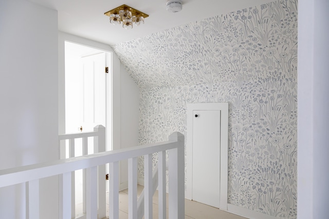 hallway with vaulted ceiling