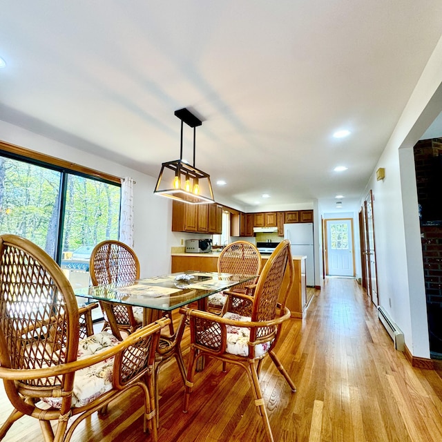 29 Lumberjack Trl, West Yarmouth, MA 02673 - dining space featuring light wood finished floors, a baseboard heating unit, recessed lighting, and baseboards