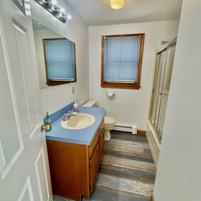 29 Lumberjack Trl, West Yarmouth, MA 02673 - full bath with baseboard heating, vanity, wood finished floors, toilet, and baseboards