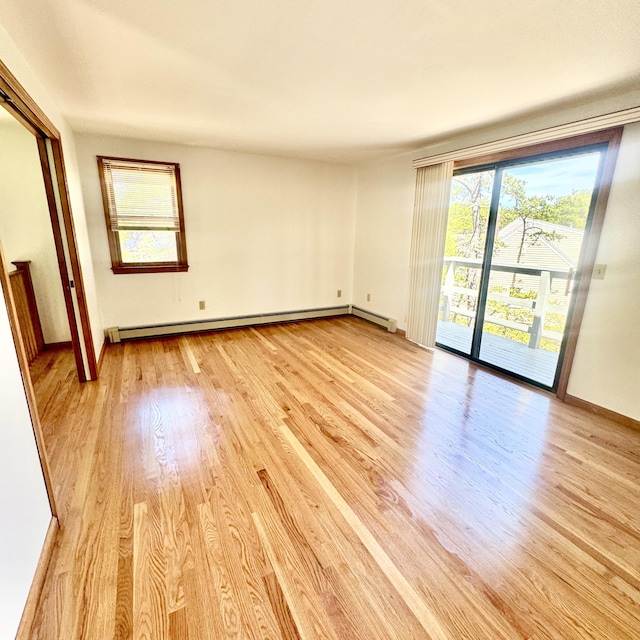 29 Lumberjack Trl, West Yarmouth, MA 02673 - spare room with a baseboard radiator, light wood-style floors, and baseboards