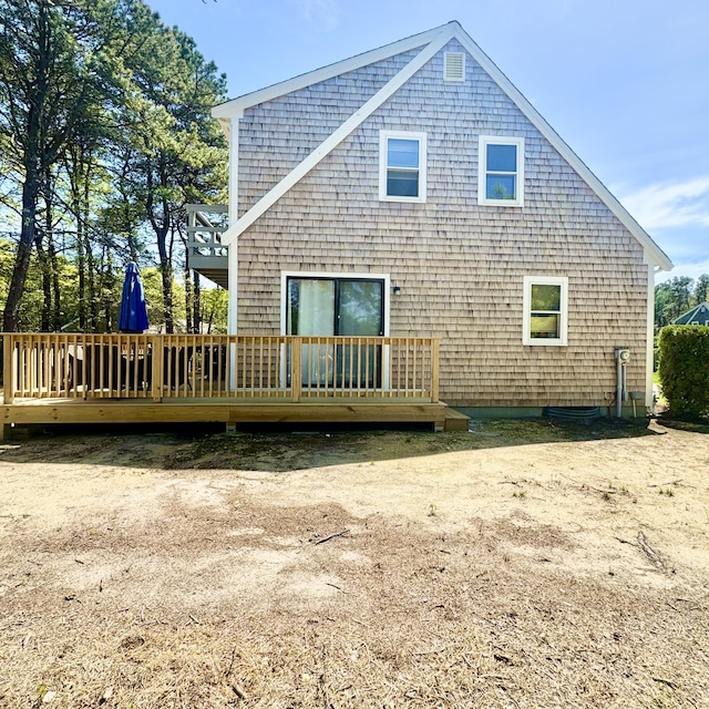 29 Lumberjack Trl, West Yarmouth, MA 02673 - back of house featuring a wooden deck