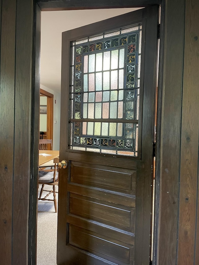 doorway with carpet floors