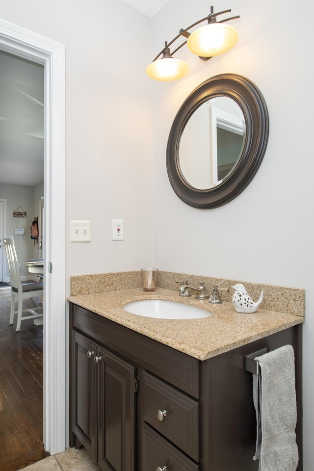 bathroom featuring wood finished floors and vanity