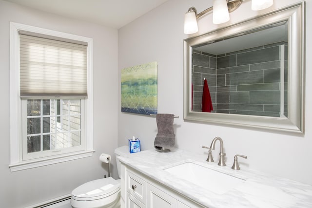 full bath with toilet, baseboard heating, and vanity