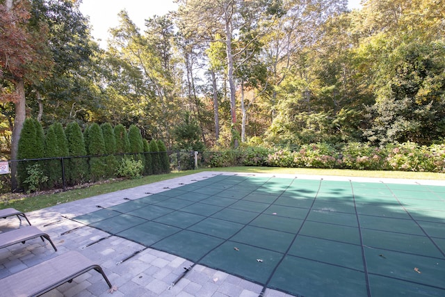 view of swimming pool featuring fence and a fenced in pool