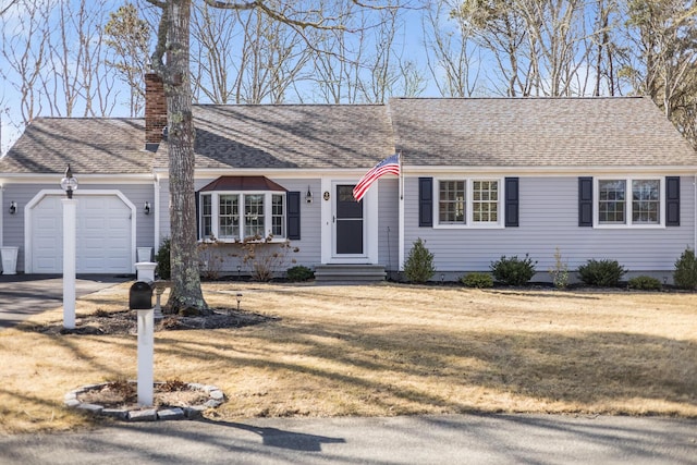 ranch-style house with a front lawn, entry steps, roof with shingles, an attached garage, and a chimney