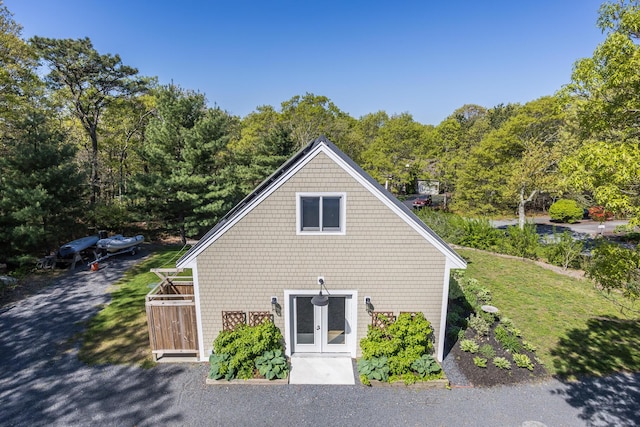 10 Westerly Dr, Bourne, MA 02532 - view of home's exterior featuring a lawn