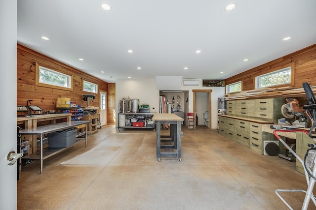 10 Westerly Dr, Bourne, MA 02532 - miscellaneous room featuring a workshop area, wood walls, recessed lighting, and concrete floors