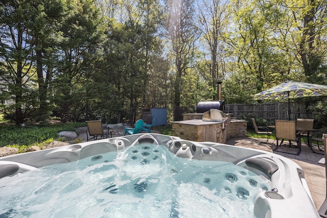 10 Westerly Dr, Bourne, MA 02532 - view of patio featuring a hot tub and fence