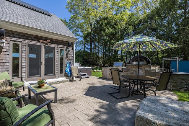 10 Westerly Dr, Bourne, MA 02532 - view of patio with outdoor dining area and an outdoor kitchen