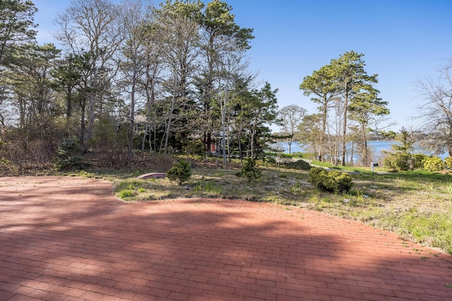 104 Seapine Rd, North Chatham, MA 02650 - wooden deck featuring a water view and a patio