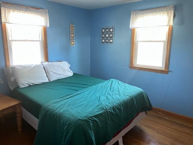 bedroom featuring wood finished floors