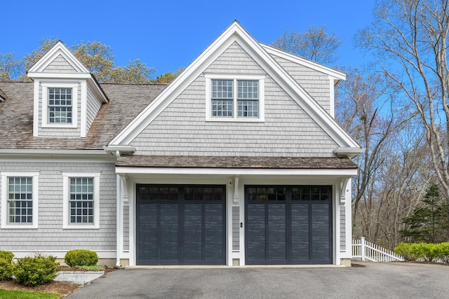 49 Atkins Rd, East Sandwich, MA 02537 - view of front facade with asphalt driveway and a garage