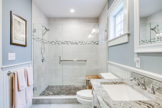 49 Atkins Rd, East Sandwich, MA 02537 - full bath with wainscoting, toilet, a shower stall, and vanity