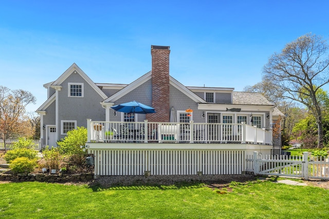 49 Atkins Rd, East Sandwich, MA 02537 - back of house with a deck and a chimney