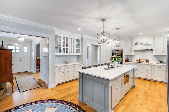 49 Atkins Rd, East Sandwich, MA 02537 - kitchen featuring white cabinets, gray cabinetry, stainless steel double oven, and light countertops