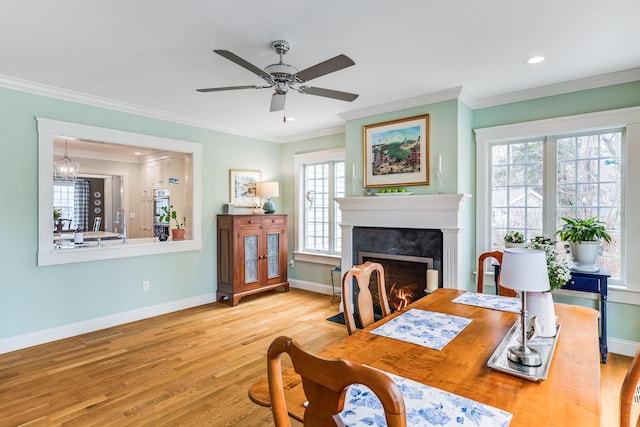 49 Atkins Rd, East Sandwich, MA 02537 - dining room featuring crown molding, a ceiling fan, baseboards, and wood finished floors