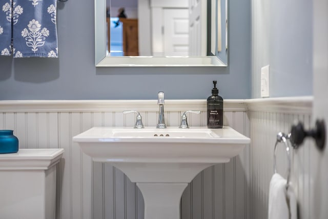 49 Atkins Rd, East Sandwich, MA 02537 - bathroom with a wainscoted wall and a decorative wall