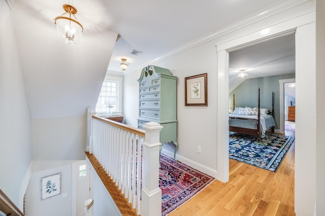 49 Atkins Rd, East Sandwich, MA 02537 - hall with visible vents, baseboards, wood finished floors, and an upstairs landing