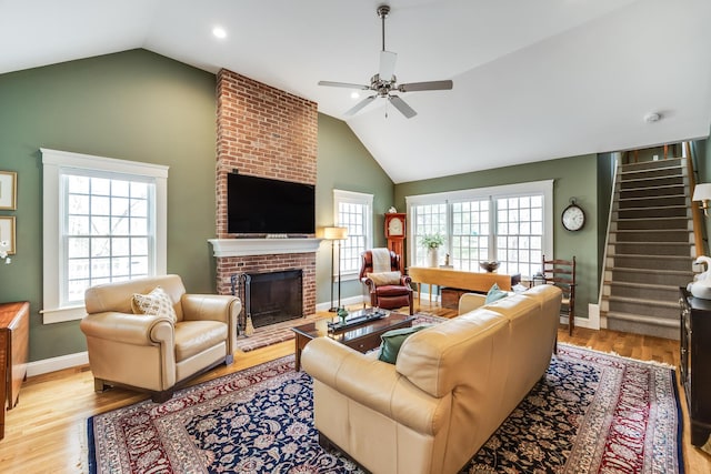 49 Atkins Rd, East Sandwich, MA 02537 - living area with a ceiling fan, light wood-type flooring, vaulted ceiling, and stairs