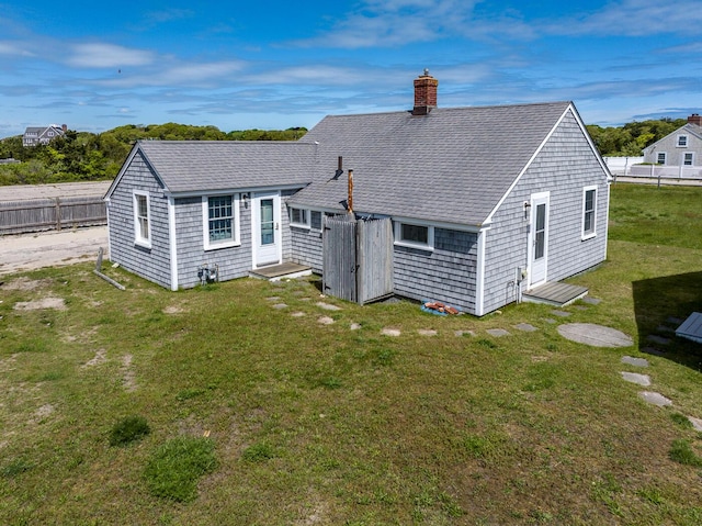 1006 Craigville Beach Rd Unit 4, Centerville, MA 02632 - back of property with a chimney and a shingled roof