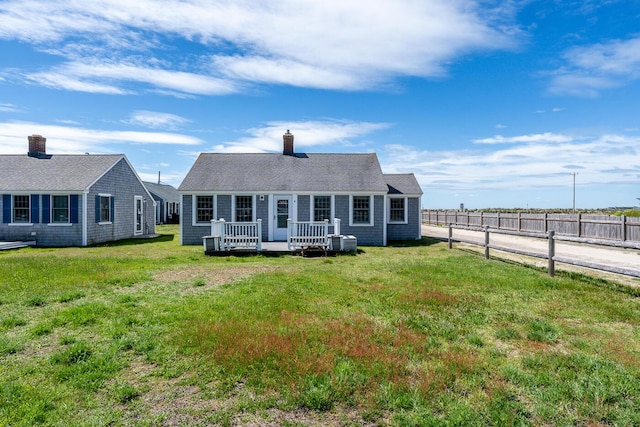 1006 Craigville Beach Rd Unit 4, Centerville, MA 02632 - rear view of property featuring a deck and a chimney
