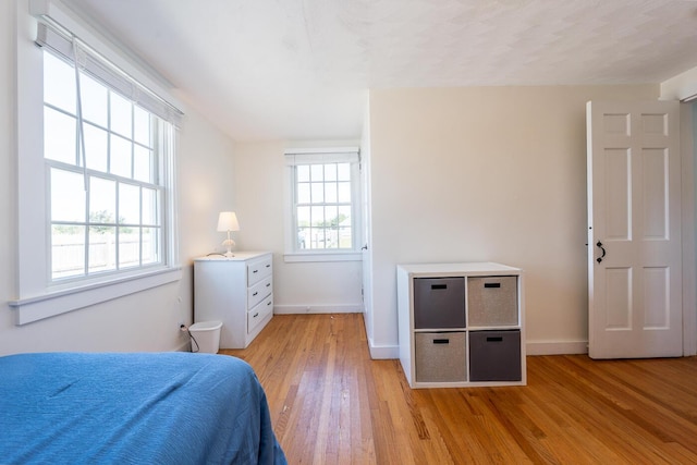 1006 Craigville Beach Rd Unit 4, Centerville, MA 02632 - bedroom featuring light wood-style floors and baseboards