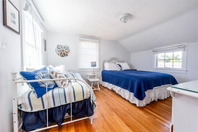 1006 Craigville Beach Rd Unit 4, Centerville, MA 02632 - bedroom with light wood-type flooring and lofted ceiling