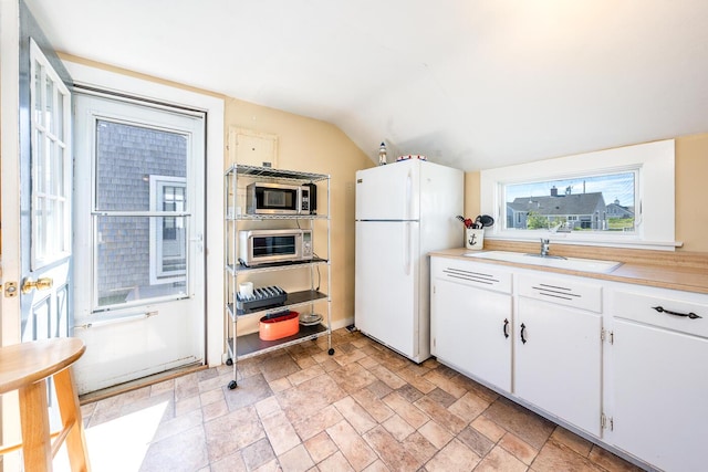 1006 Craigville Beach Rd Unit 4, Centerville, MA 02632 - kitchen featuring freestanding refrigerator, a sink, stainless steel microwave, light countertops, and lofted ceiling