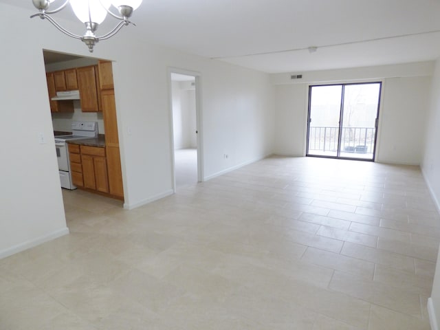 15 Oak Neck Rd Unit 2 12, Hyannis, MA 02601 - unfurnished living room featuring a chandelier
