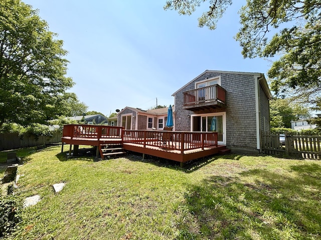 12 Amelia Way S, Yarmouth, MA 02664 - rear view of property featuring a balcony, a fenced backyard, and a wooden deck