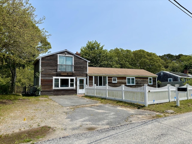 12 Amelia Way S, Yarmouth, MA 02664 - view of front of house with a fenced front yard and a chimney