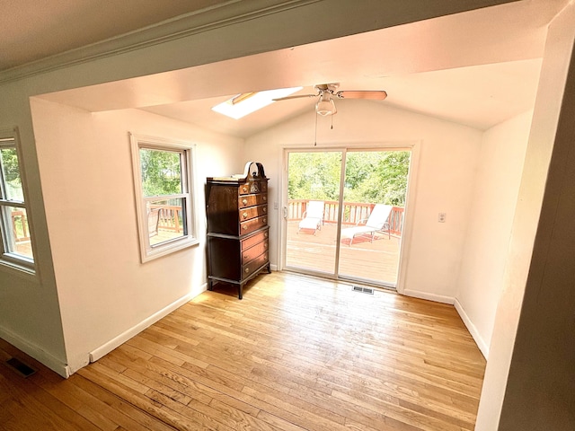 12 Amelia Way S, Yarmouth, MA 02664 - spare room featuring a ceiling fan, plenty of natural light, light wood-type flooring, lofted ceiling, and a skylight