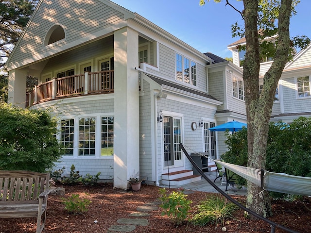 view of front of home featuring entry steps and a balcony