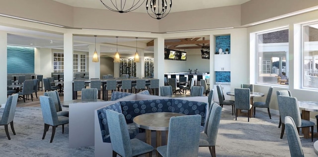 dining area featuring a notable chandelier