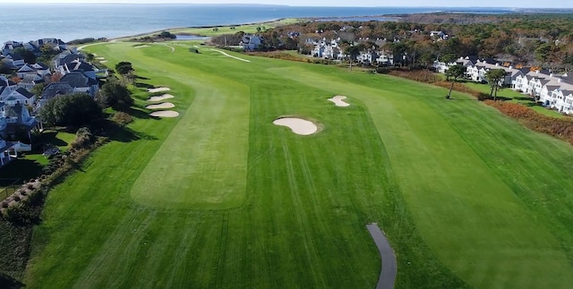 bird's eye view featuring view of golf course, a water view, and a residential view