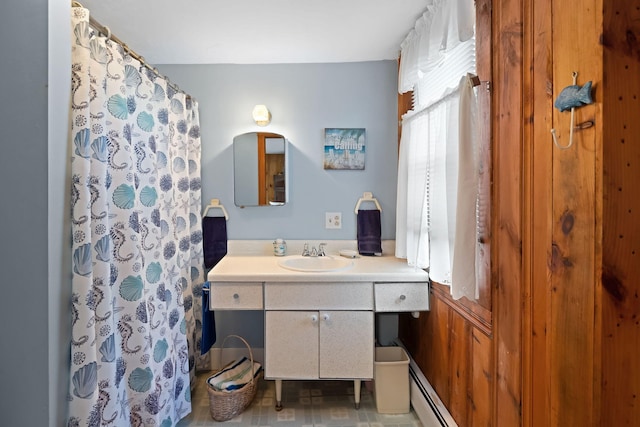 bathroom featuring a shower with curtain, a baseboard radiator, and vanity