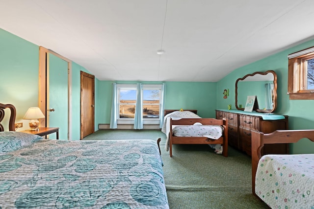 bedroom featuring multiple windows, light carpet, and lofted ceiling