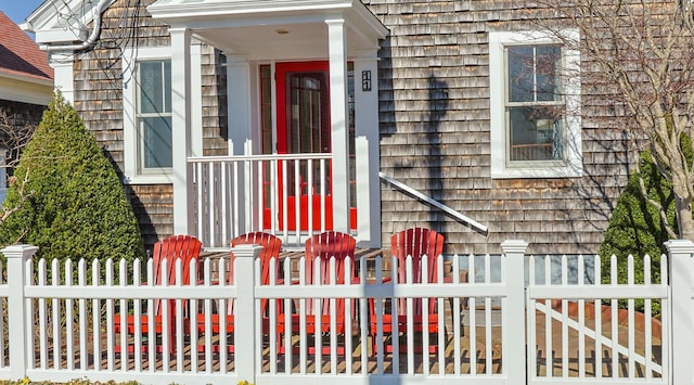 entrance to property featuring fence