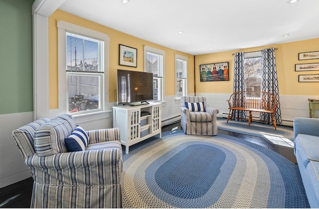 interior space with recessed lighting, wainscoting, and a baseboard radiator