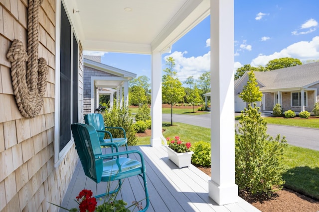 wooden deck featuring covered porch