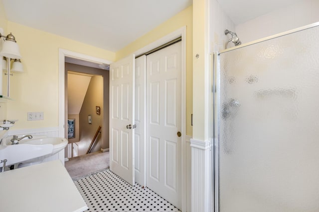 full bath featuring a shower stall