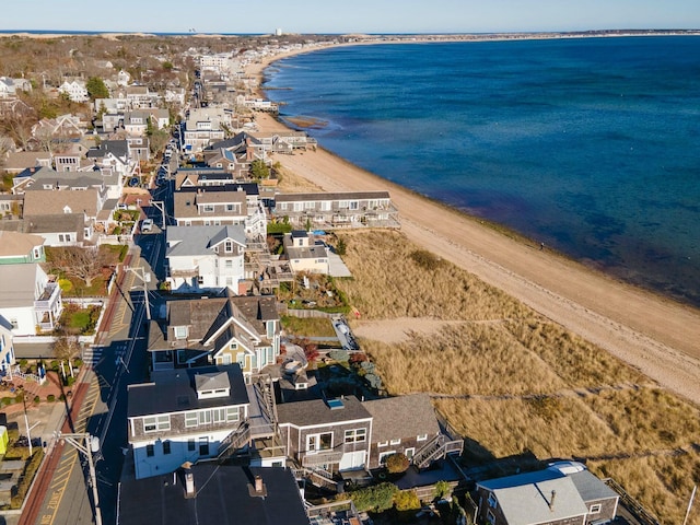 bird's eye view with a water view and a beach view