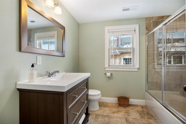 bathroom featuring toilet, baseboards, visible vents, and vanity